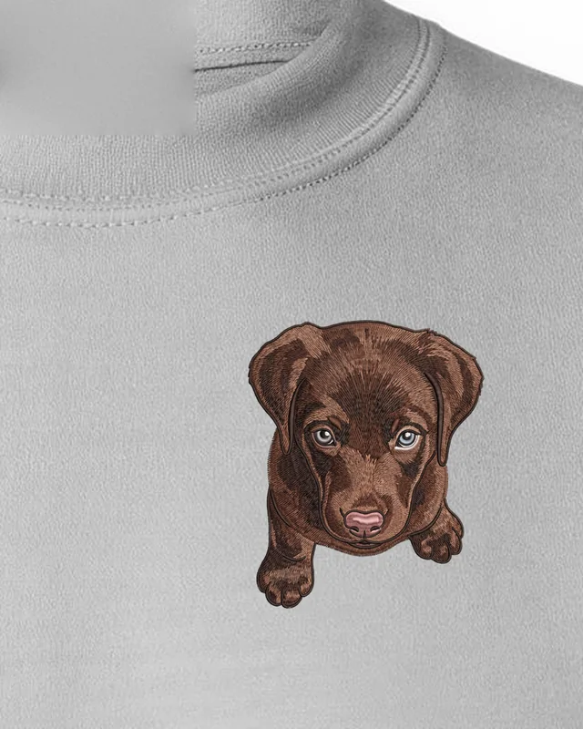 Stitched-look portrait of a chocolate Lab puppy printed on the left chest of an ash crewneck sweatshirt, made from the photo shown in the corner